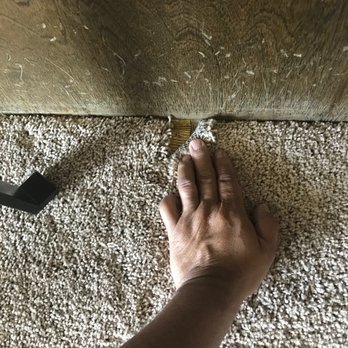 Valiente Carpet And Flooring - a person's hand on the floor - Carpet Installation Near Me - Hesperia, California