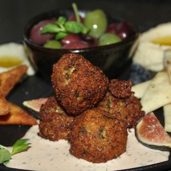 EDGE Restaurant and Bar - The Mezze Plate was made with pepper spread, hummus, tzatziki, baba ghanoush, falafel, olives, figs, and flatbread two ways. - Steakhouses Near Me - Denver, Colorado