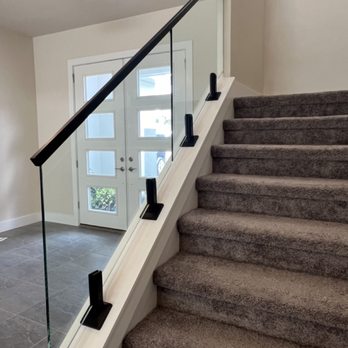 Styleguard Systems - Glass stair railing with adjustable spigots, plus black powdercoating and handrail. - Fences & Gates Near Me - West Hollywood, California Styleguard Systems - Glass stair railing with adjustable spigots, plus black powdercoating and handrail. - Fences & Gates Near Me - West Hollywood, California