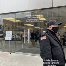 Check out the tough security staff keeping customers out while they take turns warming up inside store Check out the tough security staff keeping customers out while they take turns warming up inside store
