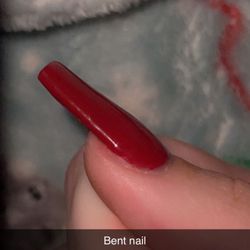 Divine Nails and Spa - Bent flat nail. This is hours after them "fixing it" mind you they charged me to fix their mistake.