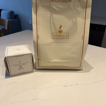 Vanilla Espresso French Café - Box containing my Rum cake and bag containing my quiche - Themed Cafes Near Me - Miramar, Florida Vanilla Espresso French Café - Box containing my Rum cake and bag containing my quiche - Themed Cafes Near Me - Miramar, Florida