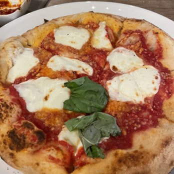 Artisan Wood Fired Kitchen - Pizza with barley any basil. - Pizza Near Me - Rogers, Arkansas Artisan Wood Fired Kitchen - Pizza with barley any basil. - Pizza Near Me - Rogers, Arkansas