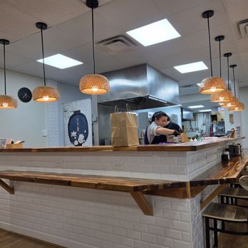 Noodle Factory - The view of the open kitchen from our table. - Ramen Near Me - Roanoke, Virginia Noodle Factory - The view of the open kitchen from our table. - Ramen Near Me - Roanoke, Virginia