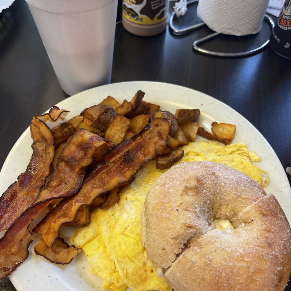 Bagel Factory - Cinnamon sugar bagel with cream cheese, 2 eggs with bacon and potatoes - Bagels Near Me - Myrtle Beach, South Carolina Bagel Factory - Cinnamon sugar bagel with cream cheese, 2 eggs with bacon and potatoes - Bagels Near Me - Myrtle Beach, South Carolina