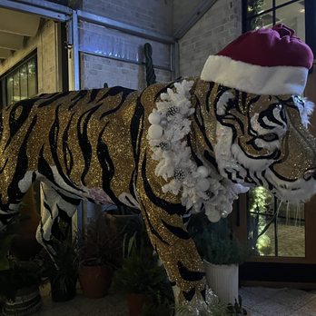 Tipsy Elf - a fake tiger wearing a santa hat - Cocktail Bars Near Me - Dallas, Texas Tipsy Elf - a fake tiger wearing a santa hat - Cocktail Bars Near Me - Dallas, Texas