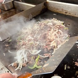 Allstar Burgers - Piles of fresh sliced steak with grilled onions and green peppers. So legit!