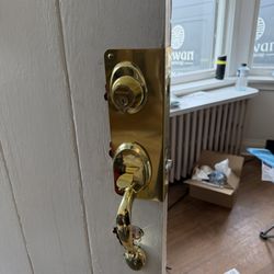 Locksmith Boys - Installed a new deadbolt with a wrap-around reinforcement plate for improved door security and durability.