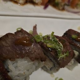 Cowboy Roll - Prime NY steak, crab meat,  avocado, cucumber,  green onion