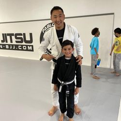 Reign Jiu Jitsu - Second stripe promotion on his grey and white belt