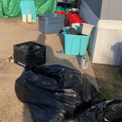 Advanced Pest Control - This is our entire garden in thee trash and all the empty buckets behind the bags used to have nice plants in them