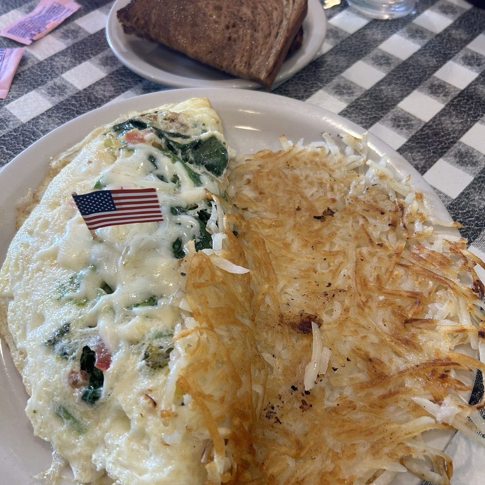 Veggie omelette, hash browns and buttered rye toast.