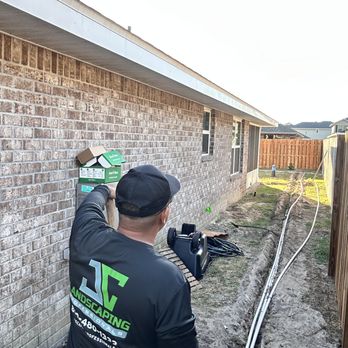 JC Landscaping Professionals - a man working on a house - Landscaping Near Me - Pensacola, Florida JC Landscaping Professionals - a man working on a house - Landscaping Near Me - Pensacola, Florida