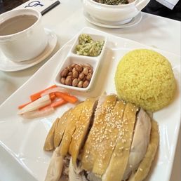 Hainan chicken rice with a side of soup, and watercress-gizzard soup Hainan chicken rice with a side of soup, and watercress-gizzard soup