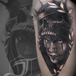 Vibrant Ink Tattoos - female face with skull tattoo