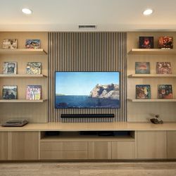 CustomBuilt-ins.com - Cottino Designs Dart LA custom wall unit entertainment center Media with sound proofing slat walls solid rift white oak slab doors drawer