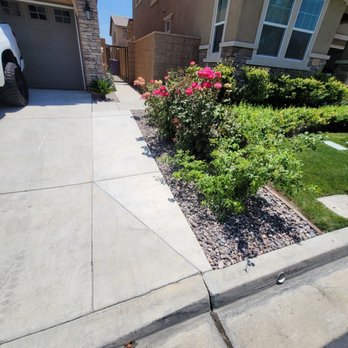 Green Dream landscape - Rose bushes were already there. Rocks and bricks installed in this area. - Artificial Turf Near Me Green Dream landscape - Rose bushes were already there. Rocks and bricks installed in this area. - Artificial Turf Near Me
