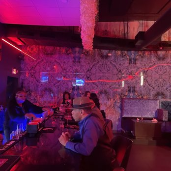 Faaji - a group of people sitting at a bar - African Near Me - Chamblee, Georgia