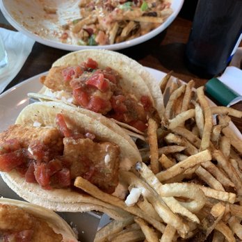 Outboards Bar & Grill - Fish tacos and what's left of the loaded potatoes. - New American Near Me - Tomahawk, Wisconsin Outboards Bar & Grill - Fish tacos and what's left of the loaded potatoes. - New American Near Me - Tomahawk, Wisconsin