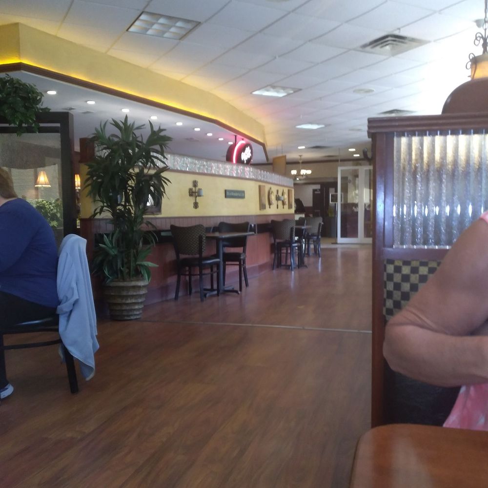 Napoli's Pizza - a woman sitting at a table - Pizza Near Me - Belpre, Ohio Napoli's Pizza - a woman sitting at a table - Pizza Near Me - Belpre, Ohio