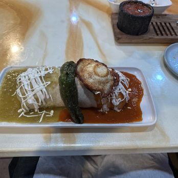 Q Chingon Mexican Restobar - Burrito with Carne Asada, topped with fried egg and jalapeño. - Mexican Near Me - Clayton, North Carolina