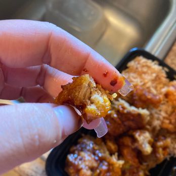 China Jade - a hand holding a piece of food - Chinese Near Me - Tempe, Arizona