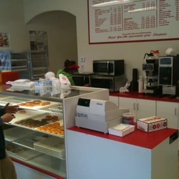 Donut Palace - a man standing in front of the counter - Breakfast & Brunch Near Me - Portland, Texas