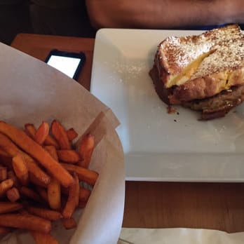 26 Beach Restaurant - #19 french toast! yumi. Great selection of bread, not too sweet, with pork sausage, litt cheese, over easy eggs, and sweet potato fries. - New American Near Me - Venice, California