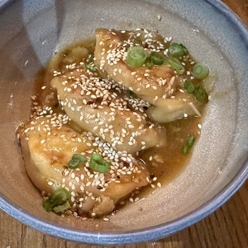 COMMUNION Restaurant and Bar - Dumplings with sausage and shrimp filling in a soy garlic chili sauce. - Soup Near Me - Seattle, Washington COMMUNION Restaurant and Bar - Dumplings with sausage and shrimp filling in a soy garlic chili sauce. - Soup Near Me - Seattle, Washington
