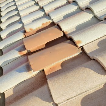 All About Roofing - Old vents reused just painted. Guess they didn't care that they painted the tiles too. Very slopy. - Roofing Near Me - Surprise, Arizona