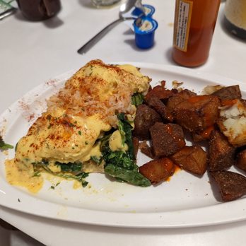Omelet Bar - Lobster Benedict with spinach and breakfast potatoes. Cut up bake potato pieces, fried with salt. - Breakfast & Brunch Near Me - Orlando, Florida Omelet Bar - Lobster Benedict with spinach and breakfast potatoes. Cut up bake potato pieces, fried with salt. - Breakfast & Brunch Near Me - Orlando, Florida