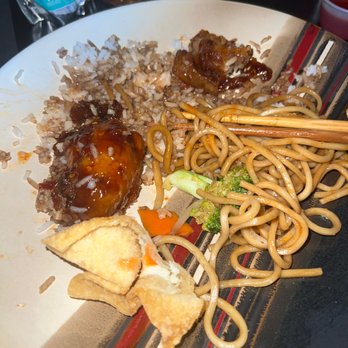 YP Hello - a plate of food on a table - Asian Fusion Near Me - Arvada, Colorado