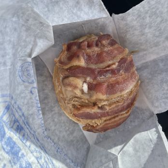 Cops & Doughnuts - Clare City Bakery - Cousin Vinny: a cinnamon roll covered with thick maple frosting and piled with chunks of bacon - Bakeries Near Me - Clare, Michigan Cops & Doughnuts - Clare City Bakery - Cousin Vinny: a cinnamon roll covered with thick maple frosting and piled with chunks of bacon - Bakeries Near Me - Clare, Michigan