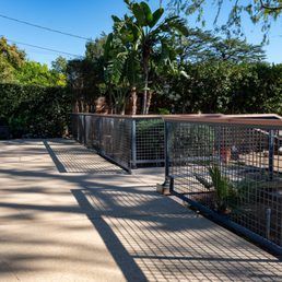Longer view of the pool fencing and lead to the steps