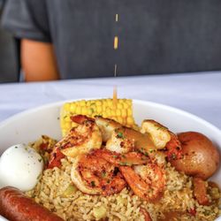 Crawfish Cafe - Tender shrimp smothered in a zesty, buttery sauce! Packed with flavor and ready to dig in.