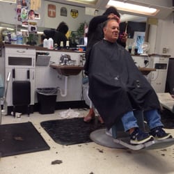 State Street Barber Shop - The owner and a client