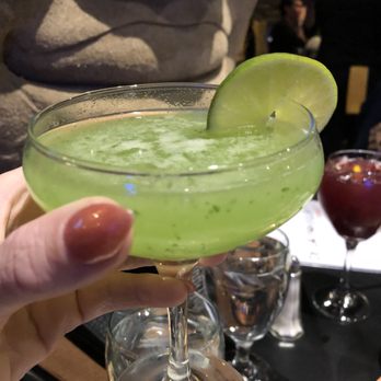 Los Andes Restaurant - Giving our buddy a sip of the best Bolivian Gimlet I have ever had in my life.  No joke this drink alone will bring me back. - Latin American Near Me - Providence, Rhode Island