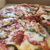 Photo of Razzo's Pizza and Salads - Oakland, CA, United States. Large pizza with pepperoni, mushrooms and half jalapenos