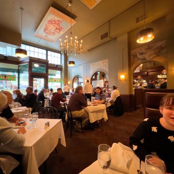 Assaggio Ristorante - people sitting at tables in a restaurant - Italian Near Me - Seattle, Washington Assaggio Ristorante - people sitting at tables in a restaurant - Italian Near Me - Seattle, Washington
