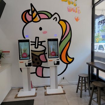 Uni Uni Bubble Tea - Lincoln Park - a woman sitting at a counter - Bubble Tea Near Me - Chicago, Illinois Uni Uni Bubble Tea - Lincoln Park - a woman sitting at a counter - Bubble Tea Near Me - Chicago, Illinois