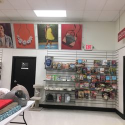 TJ Maxx - Back area with pet supplies and bathroom located in the left corner