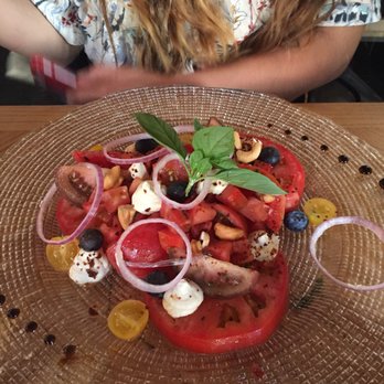 Gusto - Heirloom tomato salad with tofu ricotta. - Spanish Near Me - Seville, SE Gusto - Heirloom tomato salad with tofu ricotta. - Spanish Near Me - Seville, SE