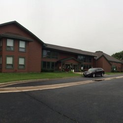 Cross Wind Conference Center - Panorama view of the Convention Center with rooms on the left end, and parking area.
