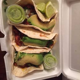 Soft tacos with flour tortillas and green salsa on the side Soft tacos with flour tortillas and green salsa on the side