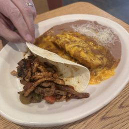 Combo fajita taco with a pork tamale and refried beans...so good Combo fajita taco with a pork tamale and refried beans...so good