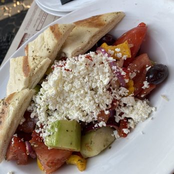 Opa! Authentic Greek - Campbell - HORITAIKI GREEK VILLAGE SALAD Ripe red tomatoes, cucumbers, red onions, peppers, Kalamata, fresh oregano, crumbled feta, warm Pita 9/26/21 - Greek Near Me - Campbell, California Opa! Authentic Greek - Campbell - HORITAIKI GREEK VILLAGE SALAD Ripe red tomatoes, cucumbers, red onions, peppers, Kalamata, fresh oregano, crumbled feta, warm Pita 9/26/21 - Greek Near Me - Campbell, California