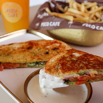 Simcha Cafe - The perfect lunch: our cheese pesto panini on sourdough, dipped in sauce, with crispy fries and fresh orange juice! - Breakfast & Brunch Near Me - Los Angeles, California Simcha Cafe - The perfect lunch: our cheese pesto panini on sourdough, dipped in sauce, with crispy fries and fresh orange juice! - Breakfast & Brunch Near Me - Los Angeles, California