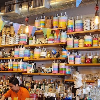 Pinto Thai Culpeper - Lunchboxes! So pretty. It's the wall at the bar. - Thai Near Me - Culpeper, Virginia
