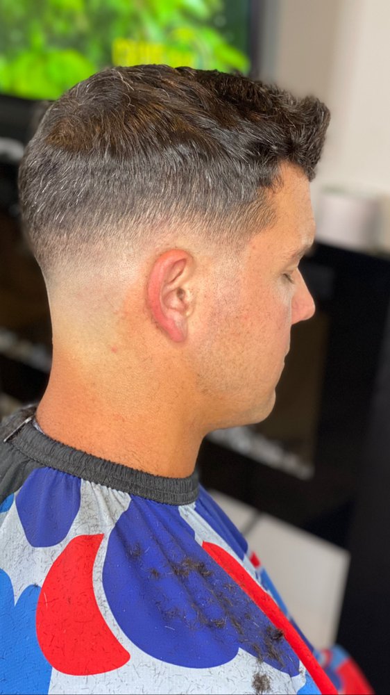 Clipper over Comb Mobile Barber Lounge Logo