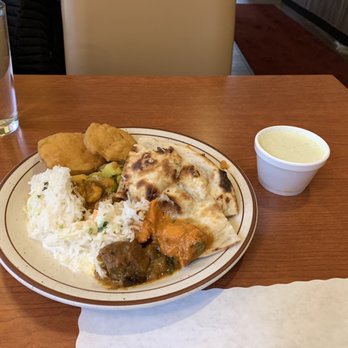 Madras Masala - Rice, mixed bhaji, poryal, aloo gobi, paneer makhni, naan, coconut chutney, goat curry and the best butter chicken ever - Indian Near Me - Ann Arbor, Michigan Madras Masala - Rice, mixed bhaji, poryal, aloo gobi, paneer makhni, naan, coconut chutney, goat curry and the best butter chicken ever - Indian Near Me - Ann Arbor, Michigan